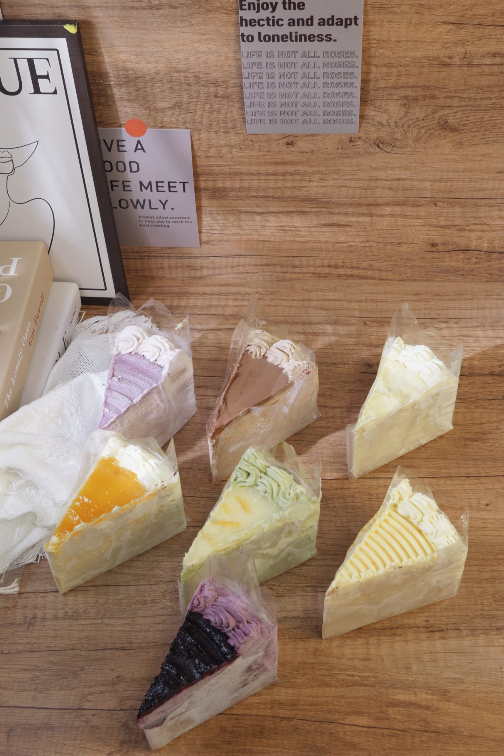 Slices of HoneyMe mille crepe cake in assorted flavors