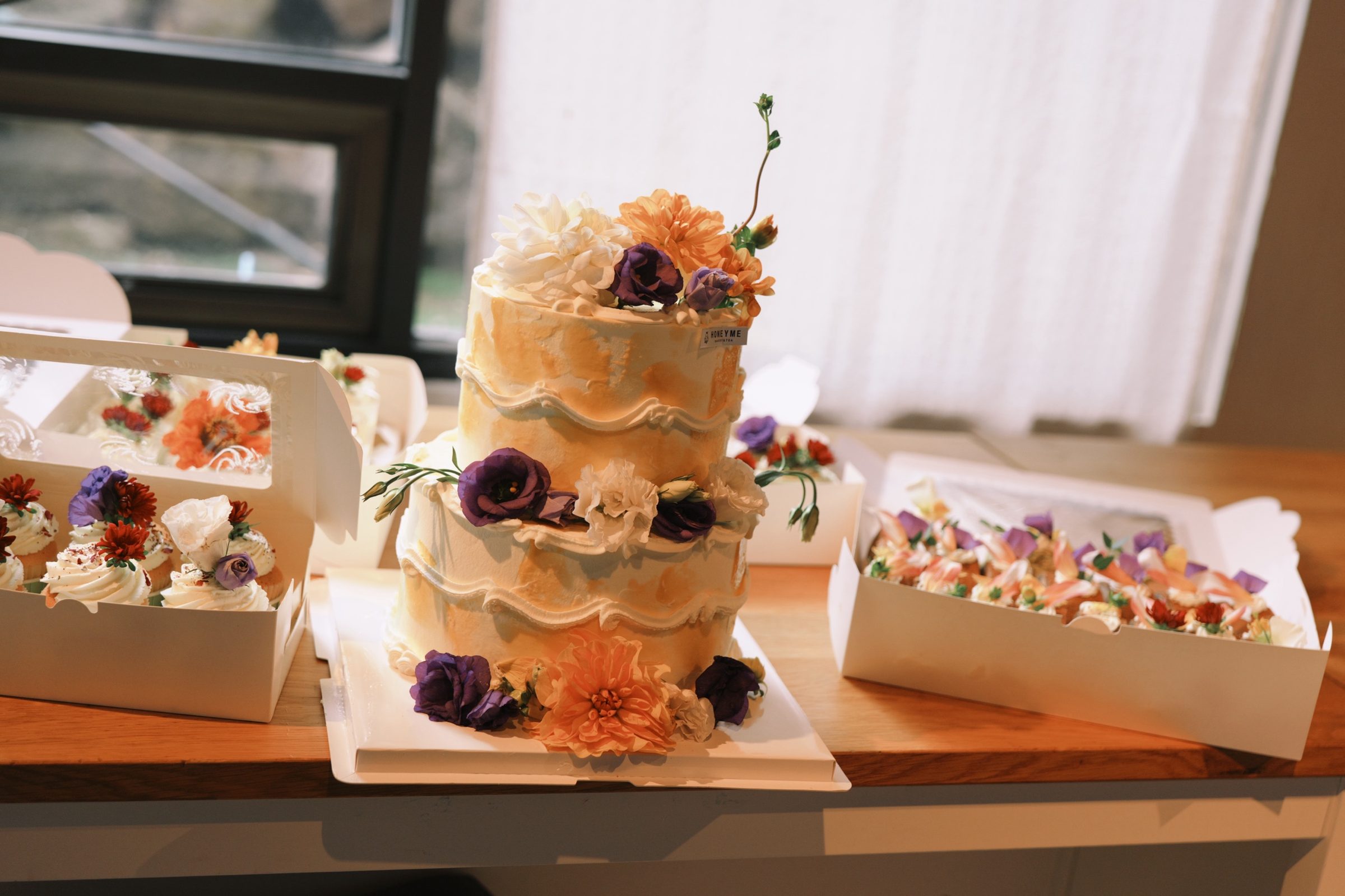A tiered floral custom cake from HoneyMe Bakery
